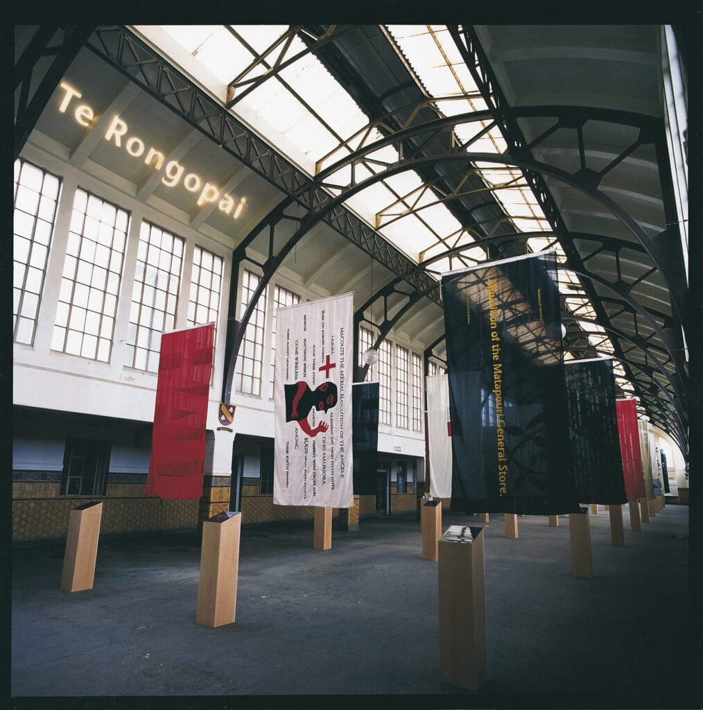 Station of Earth-Bound Ghosts flags with Te Rongopai projected above
