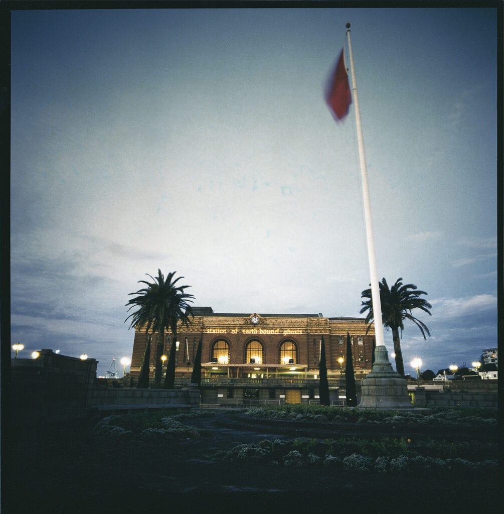 Station of Earth-Bound Ghosts title projected on Auckland Railway Station
